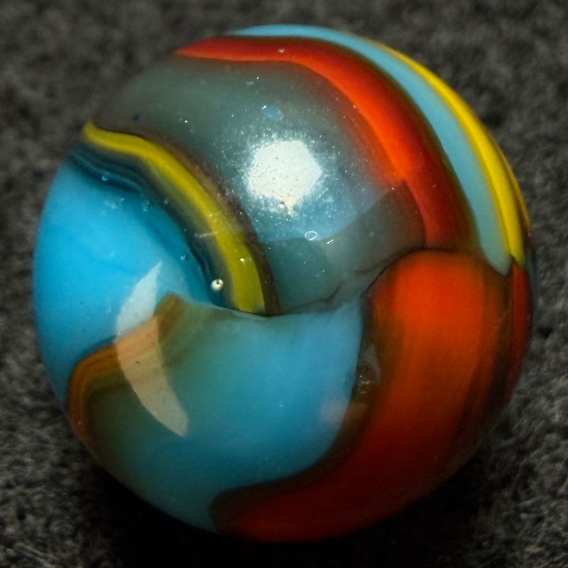 PELTIER GLASS CO. Superman Marble (0.61 inch) Striking Pattern. Display Ready