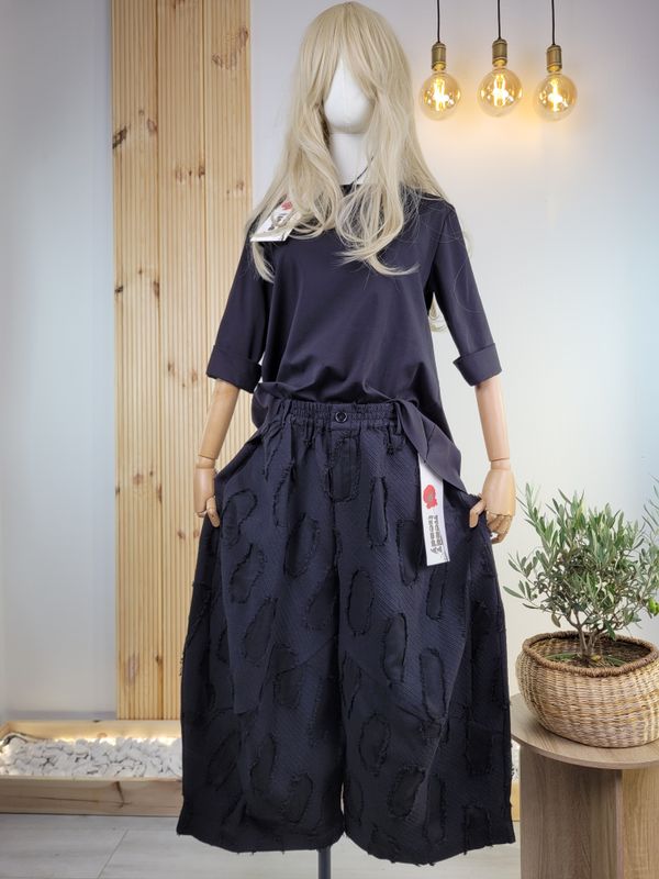 Wide barrel pants with irregular circle pattern by Wendy Trendy