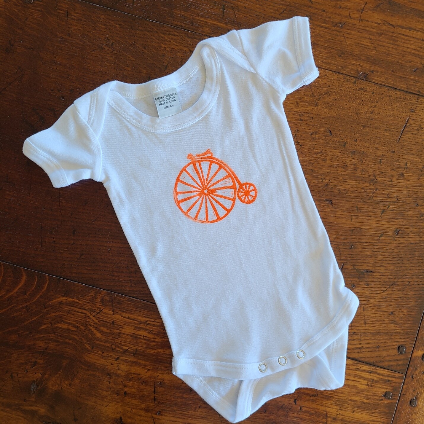 &quot;Keep on Pedaling&quot;  - 100% Organic Cotton Infant&#39;s Onesie
