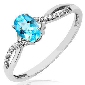 Oval Blue Topaz Ring with Diamond Accent and Split Shoulders 14KT Gold Oval Blue Topaz Ring with Diamond Accent and Split Shoulders 14KT Gold