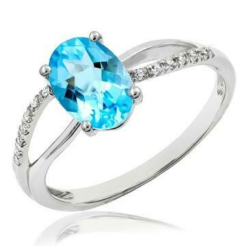 Oval Blue Topaz Ring with Diamond Accent and Split Shoulders 14KT Gold Oval Blue Topaz Ring with Diamond Accent and Split Shoulders 14KT Gold