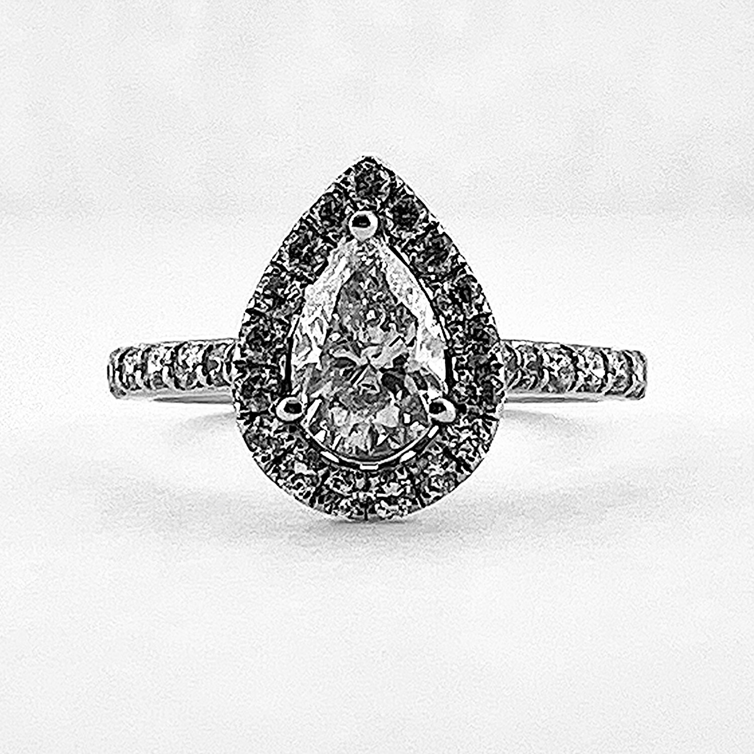 Pear cut diamond halo on sale ring