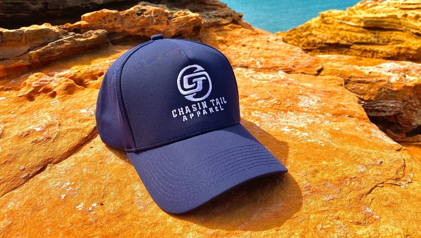 CHASIN TAIL SIGNATURE D-LUX 5 Panel Trucker Hat. Navy Blue