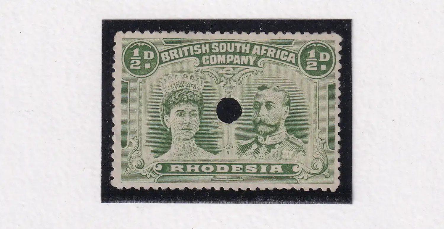 Rhodesia 1910 King George V, Double Heads. 1/2d perf 14x14 with hole punch.