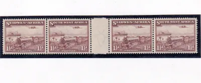 South West Africa 1937 Pictorial definitive (perf. up). 1½d additional value, horizontal strip of four across the inter panneau margin. Very fine, unused without gum. Ex Archives. MNH (**) South West Africa 1937 Pictorial definitive (perf. up). 1½d additional value, horizontal strip of four across the inter panneau margin. Very fine, unused without gum. Ex Archives. MNH (**)