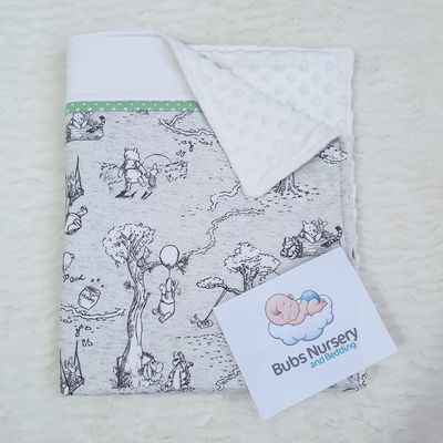 Neutral Winnie the Pooh & friends Cradle/Pram blanket with soft Minky dimple dot backing.