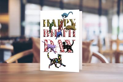 5 x 7" portrait greetings card featuring illustrated tartan cats in a playful birthday design.