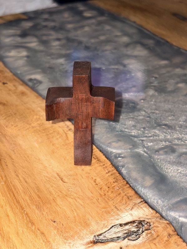 Clutching prayer cross