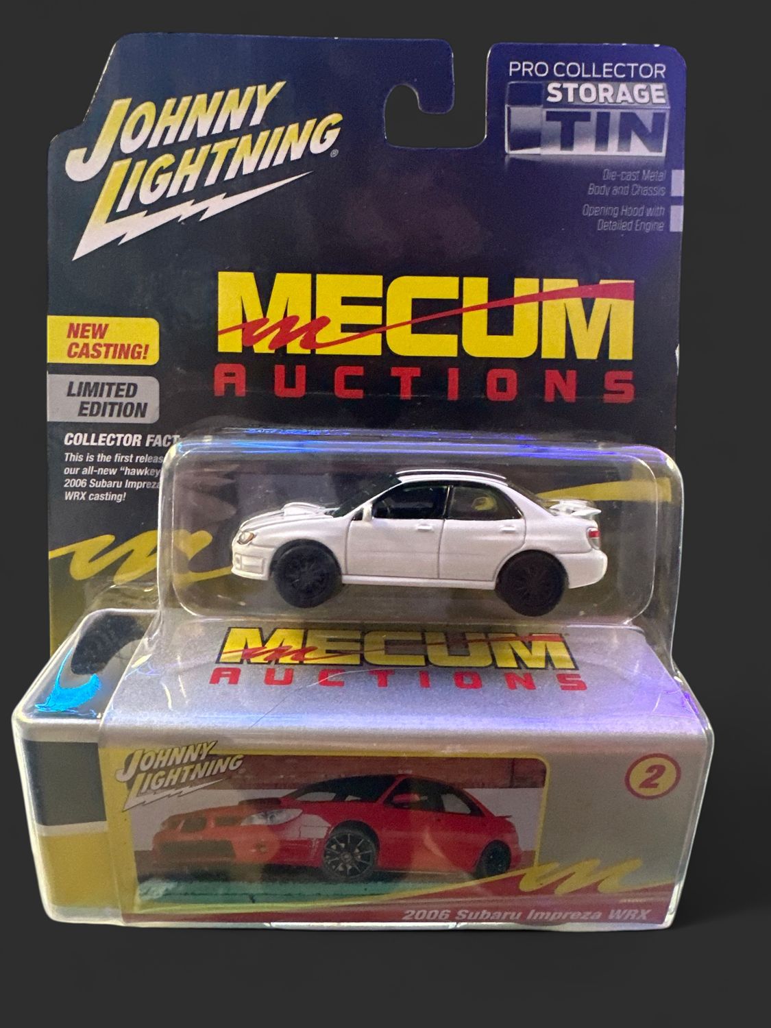 Johnny Lightning MECUM AUCTIONS COLLECTOR TIN  2006 SUBARU IMPREZA WRX WHITE