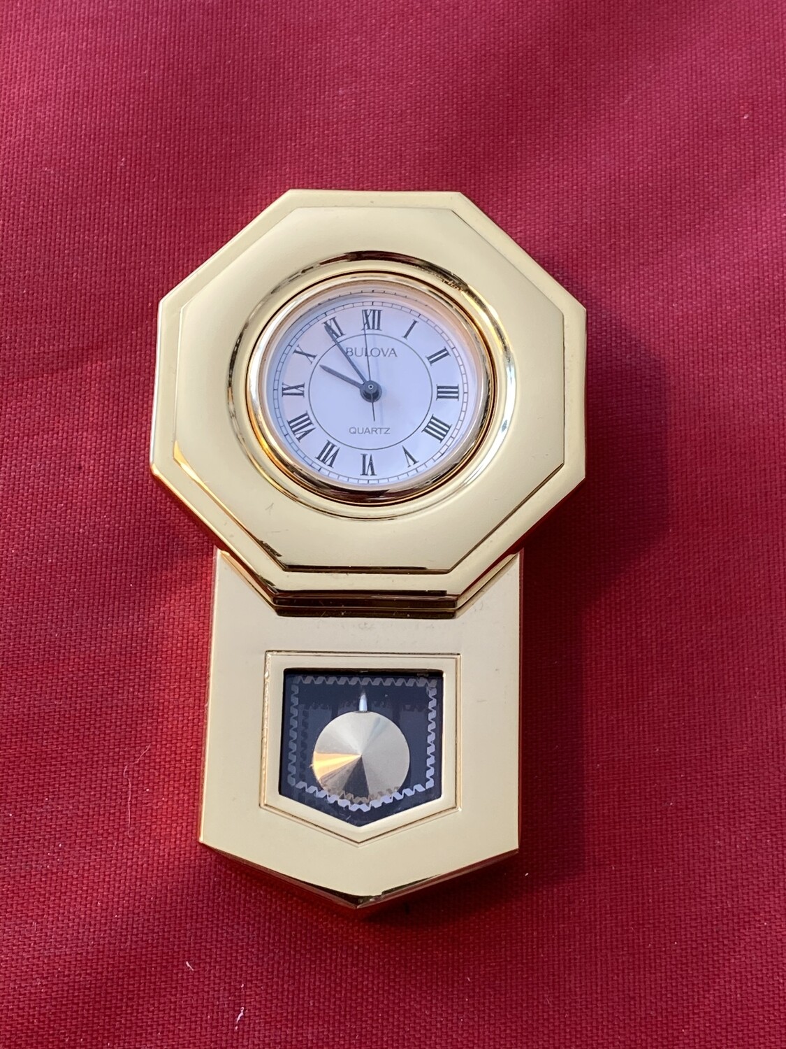 Unusual Bulova Quartz Battery Miniature Wall Clock in the Style of a Long Clock, mid 80's