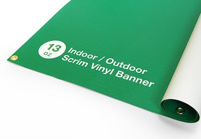 Close-up of 13oz scrim vinyl banner material, showing the textured surface for outdoor durability.