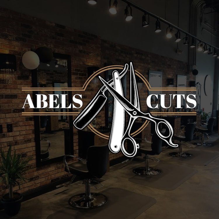 Abel’s Cuts barber logo mockup in shop interior — professional logo design sample