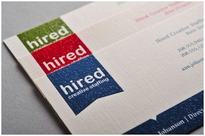 Raised print linen business cards with textured finish on uncoated stock