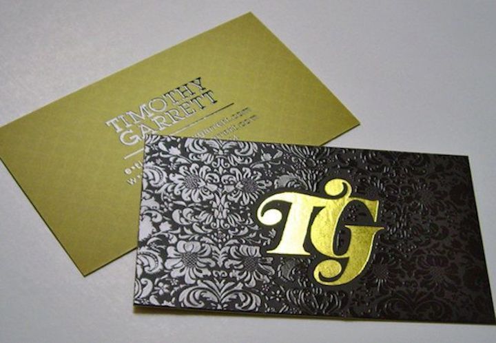 Premium foil pressed business cards with metallic shine on 18pt laminated cardstock