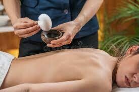 Heated Herbal Bolus Massage with Indian Head Massage.