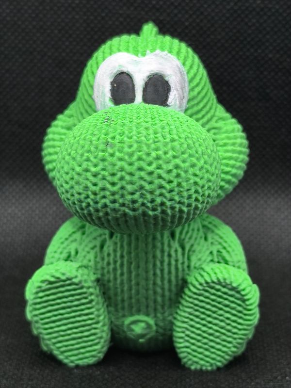 Putziger kleiner Yoshi mit Strickmuster und süßen Augen