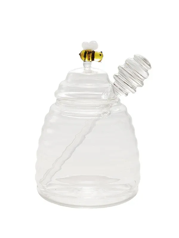Glass honey pot with bee figure/honey dipper
