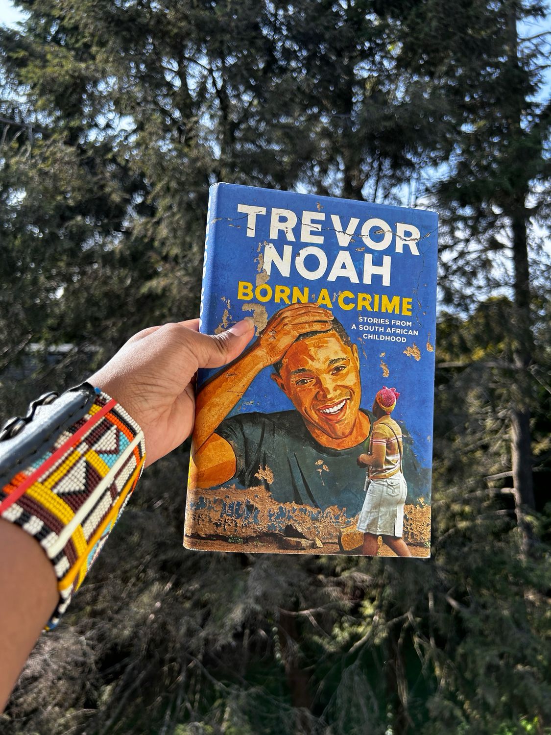 Born a Crime by Trevor Noah – Pre-owned copy of Born a Crime by Trevor Noah, a humorous and moving memoir about growing up biracial under apartheid in South Africa.