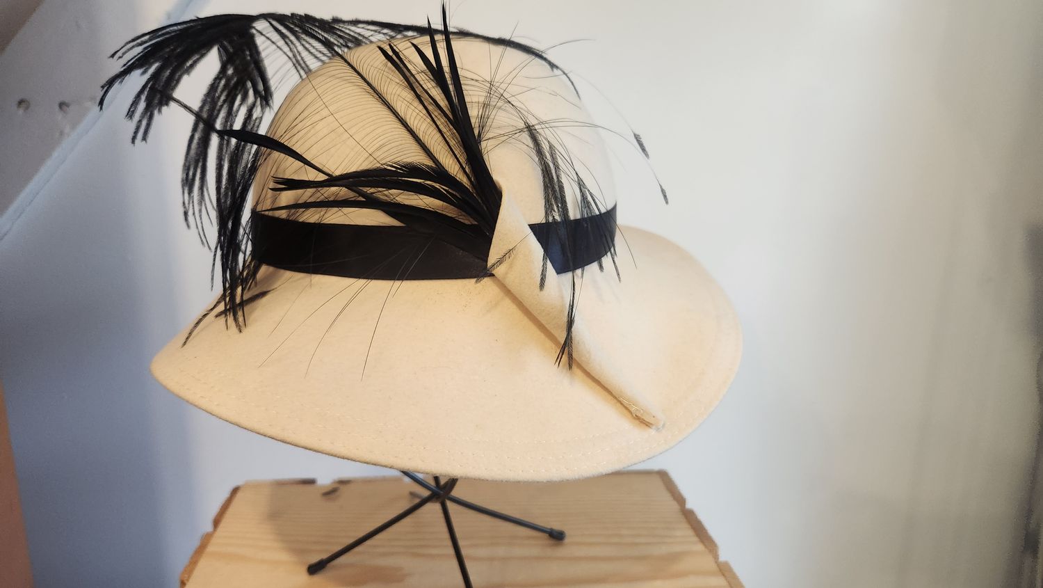 White Wool Head with Black Feather