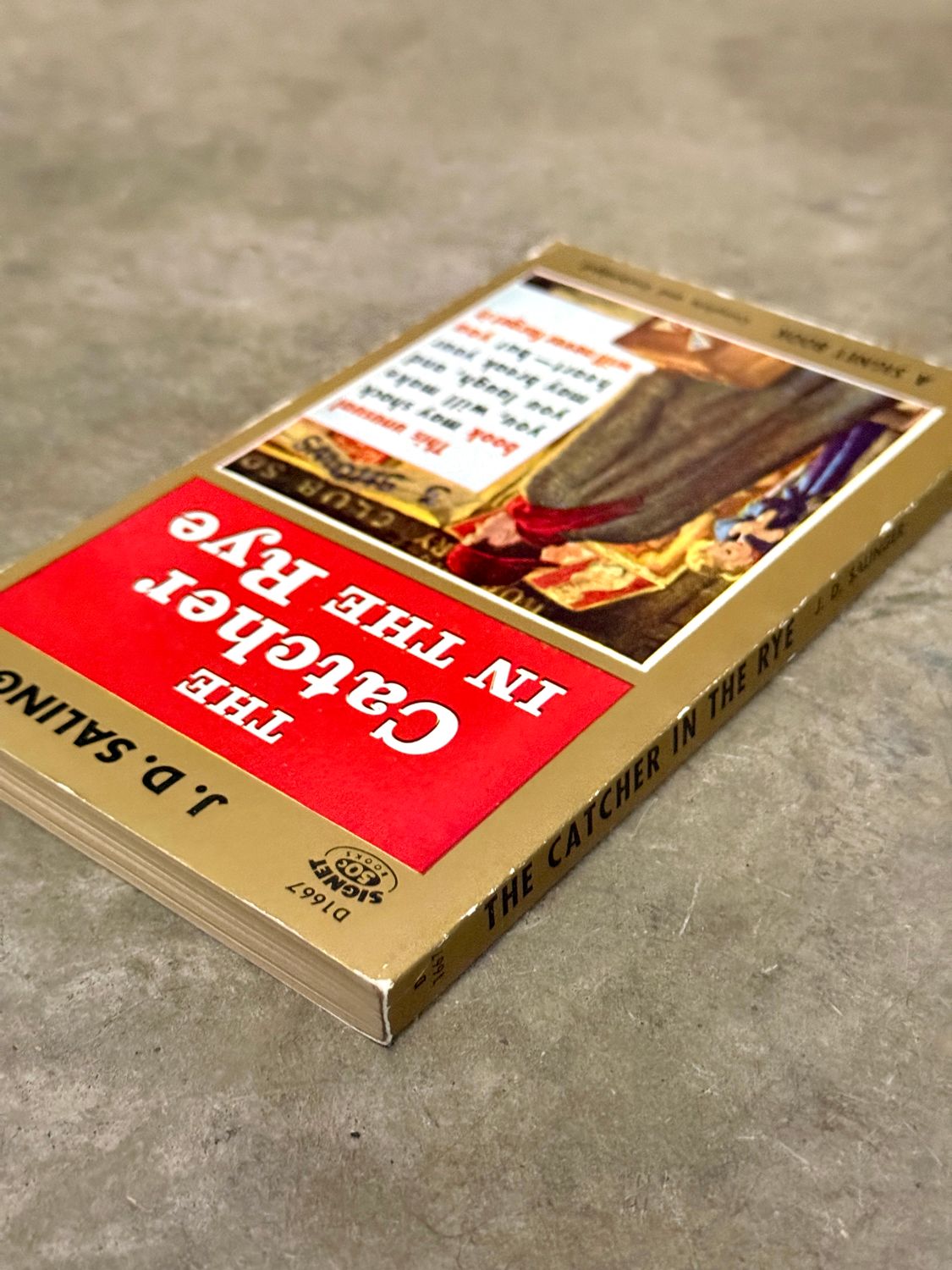 The Catcher in the Rye by J. D. Salinger (Signet D1667, 20th Printing, February 1962)