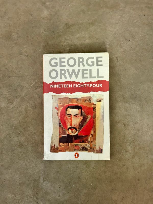 Nineteen Eighty-Four by George Orwell  (Penguin Books, 1990 Reprint, Christopher Corr Cover)
