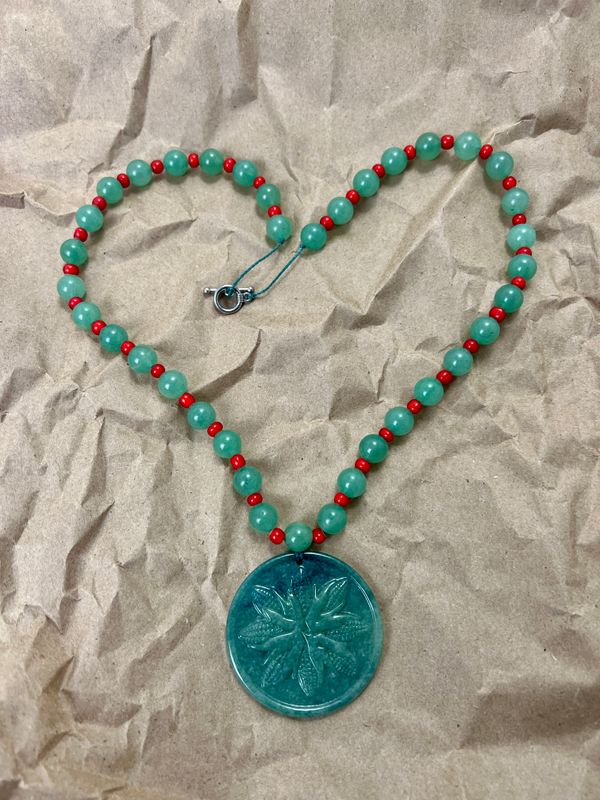 Sacred Corn Mandala pendant necklace honoring Mayan spirituality