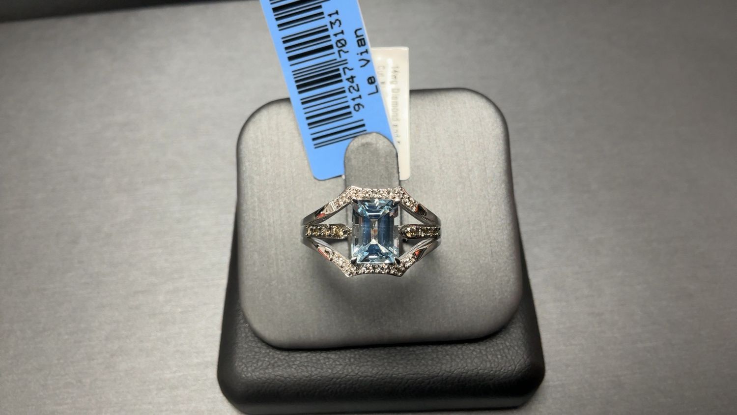 14wg Diamond and Emerald Cut Blue Topaz Center Ring