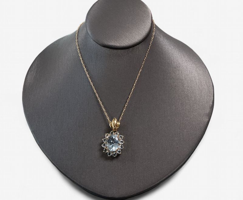 14k Yellow Gold Oval Aquamarine Pendant with Round Aquamarine Accents