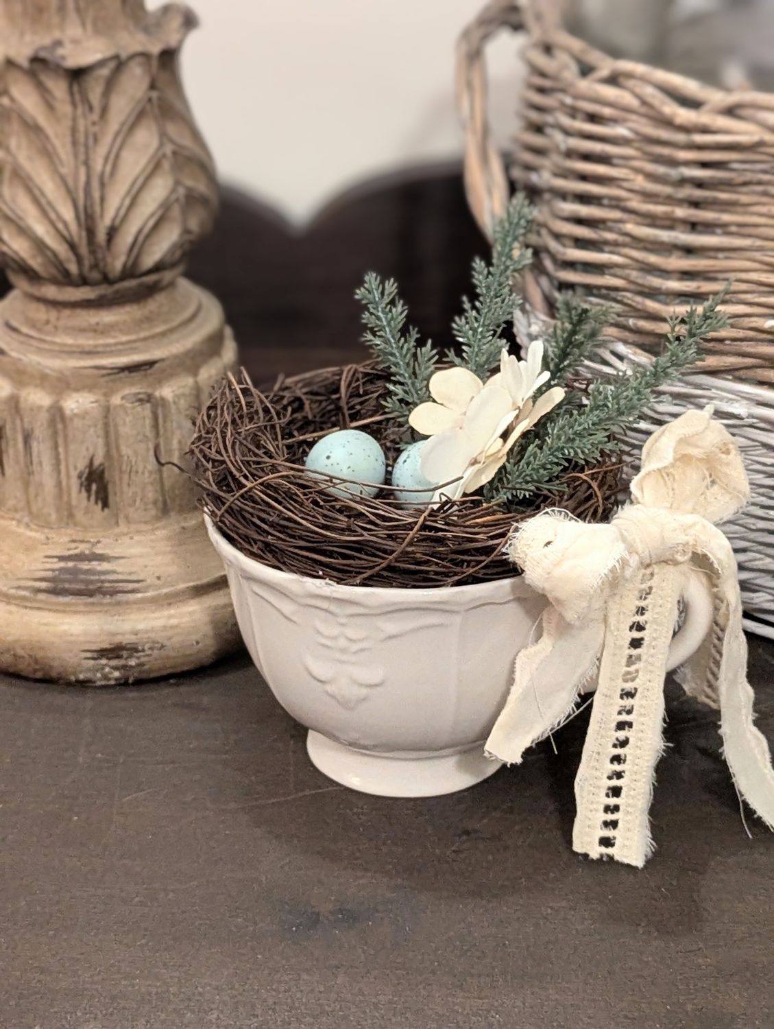 Winter themed bird nest in tea cup