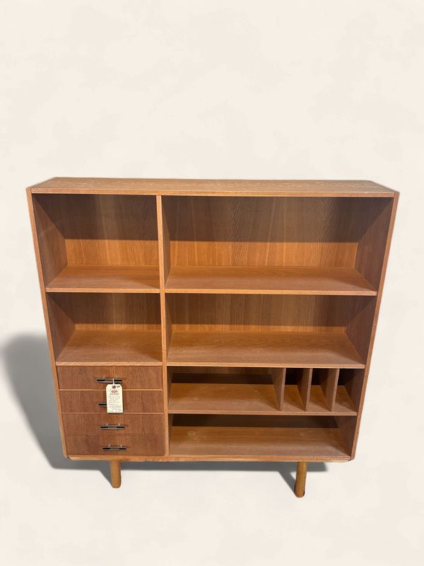 S43 - Danish Oak bookshelf; fun shelf variation with 4 surprise lower drawers with black accent hardware