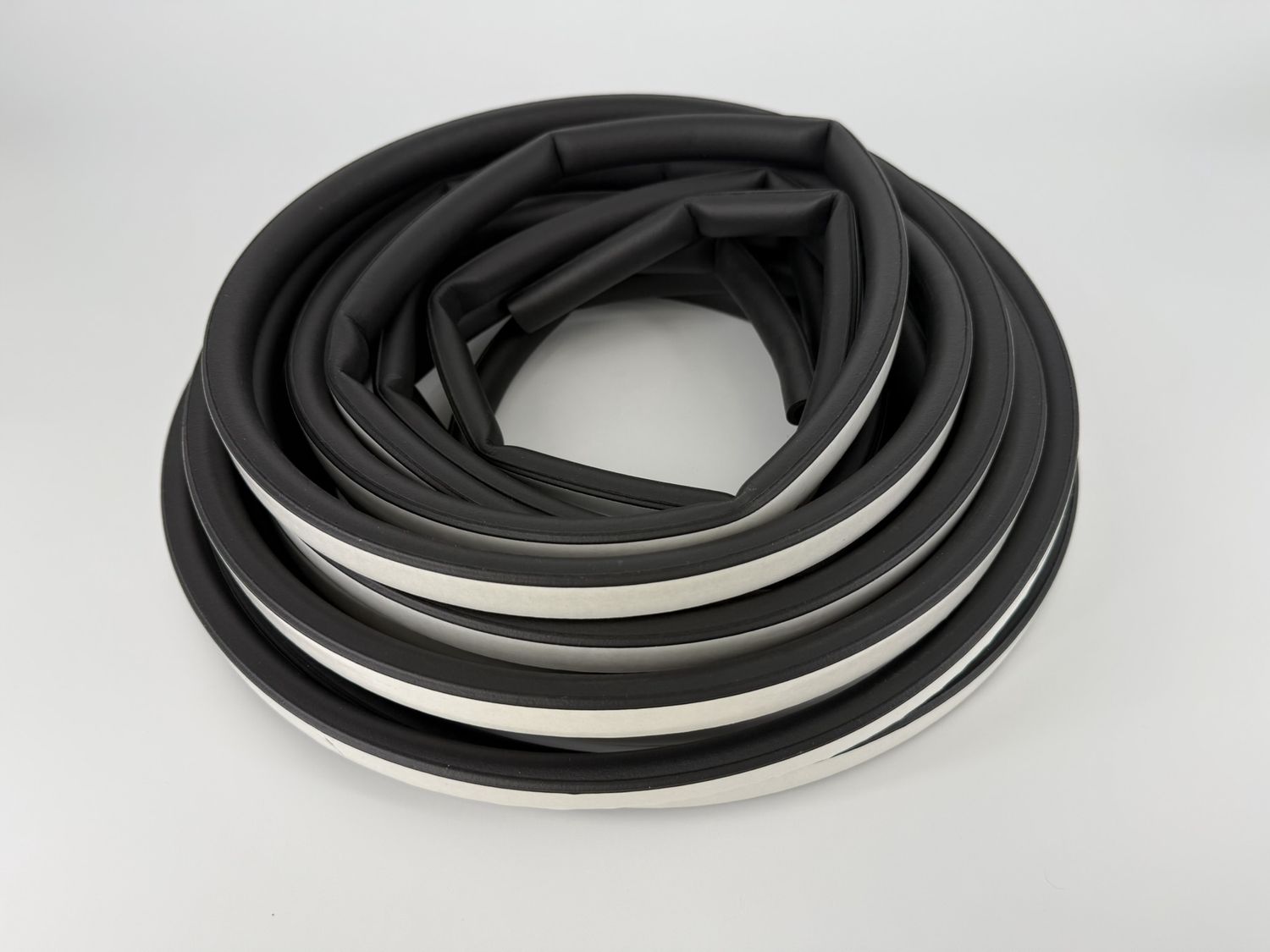 D-SEAL WITH PSA TAPE, 3/4"X1/2"X 50 FT. PRICED/FOOT.