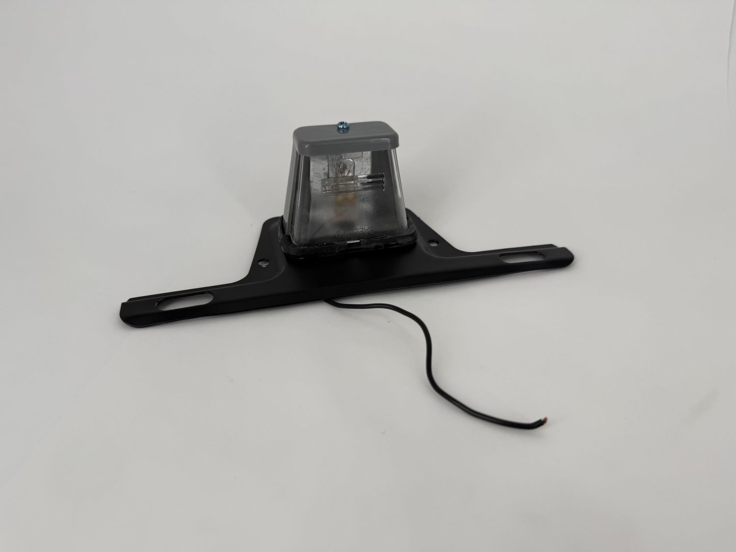 LICENSE PLATE LIGHT W/BRACKET, INC.