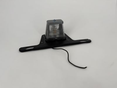 LICENSE PLATE LIGHT W/BRACKET, INC.