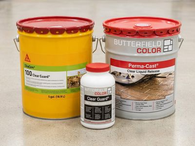 SikaCem and Butterfield Color concrete sealer pails beside a Clear Guard slip-resistant additive bottle.