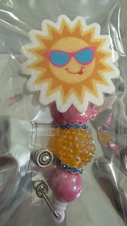 Smiling Sunburst Badge Reel