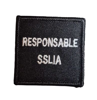 Grade / galon RESPONSABLE SSLIA / Pompiers d’aéroport - broderie blanc sur tissu noir avec support auto-agrippant BG-SAFETY