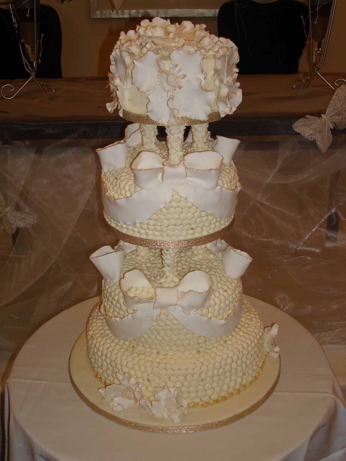 A Ivory Handcrafted Piped, Bow & Flower Wedding Cake