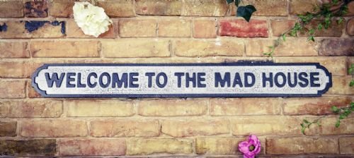 Welcome To The Mad House Sign