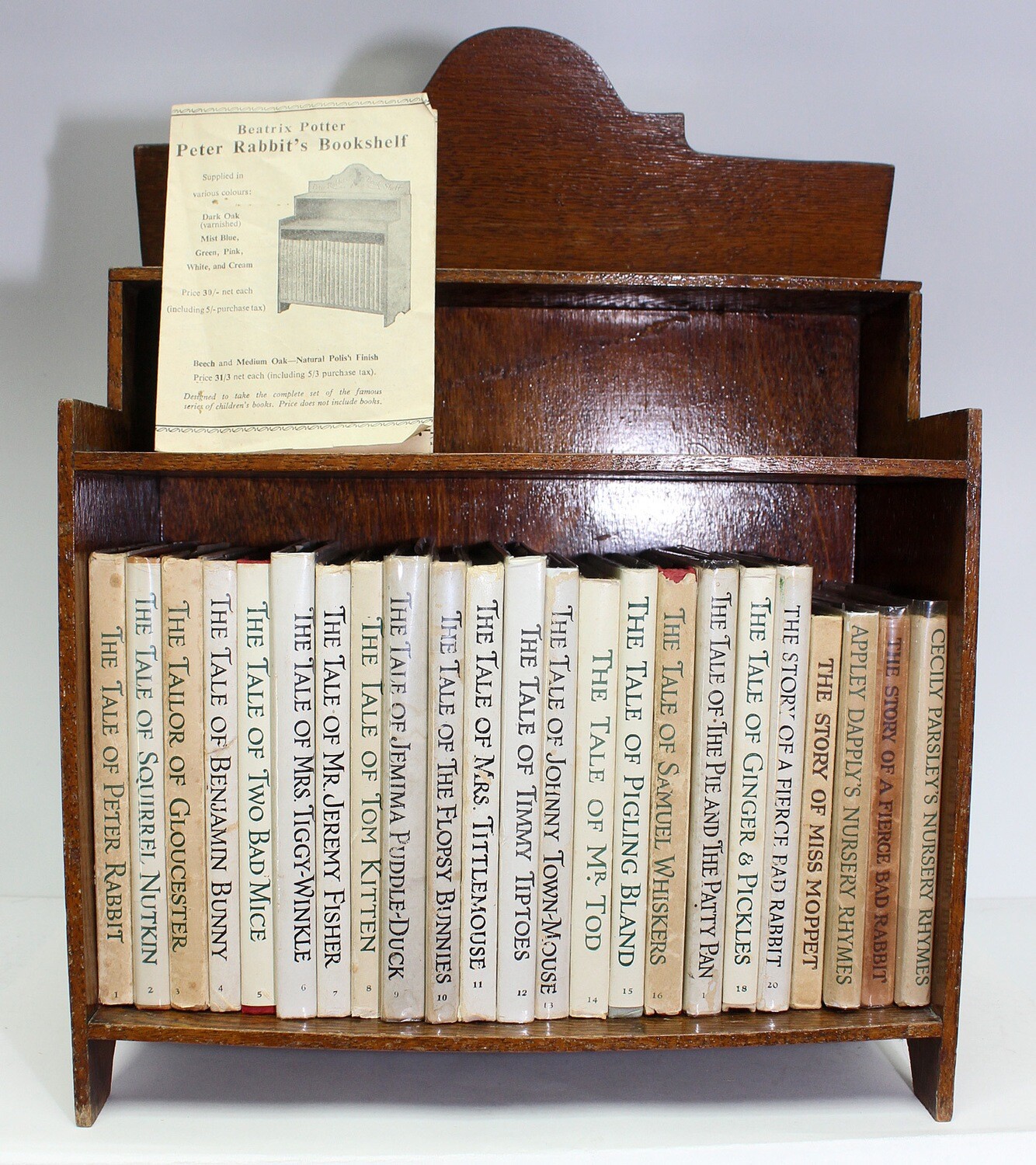 An Original 1940/50&#39;s Beatrix Potter Bookcase and 23 Volumes of a Contemporary set of Potter books from the 1940&#39;s. Including The Tale of Peter Rabbit, The Tale of Squirrel Nutkin