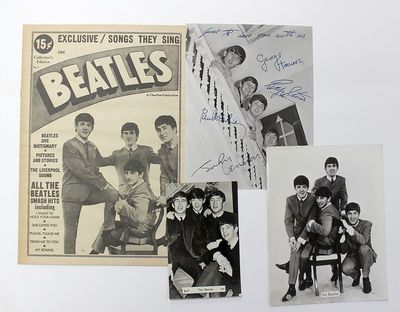 A Small Collection of Three Original Photograph Postcards and a Magazine of the Beatles. All circa 1963/1964.  Pre-printed signatures on one photograph.