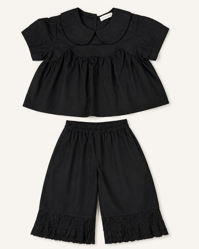 Black two-piece girls’ set front view with Peter Pan collar and embroidered trouser hems