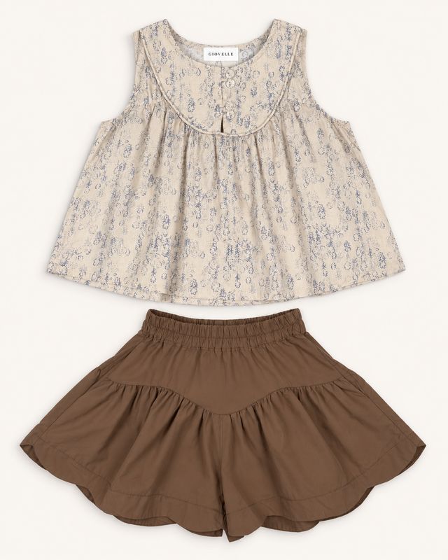 Beige botanical sleeveless top and coffee-brown flared shorts set front view.
