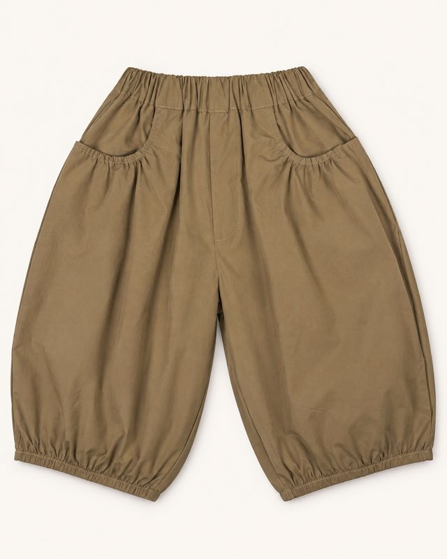 Warm khaki-taupe balloon trousers front view with gathered pockets and elasticated hems.