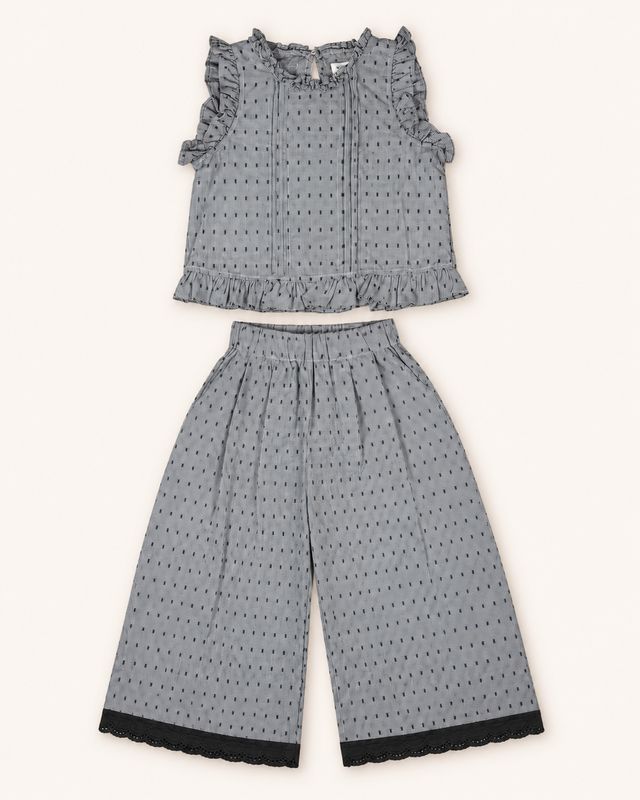 Grey and black ruffle top and wide-leg trouser set front view.