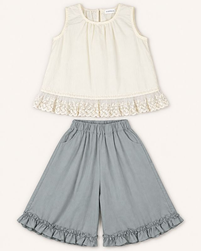 Silver Meadow two-piece set front view with ivory sleeveless lace-trimmed top and stone-grey wide-leg trousers.