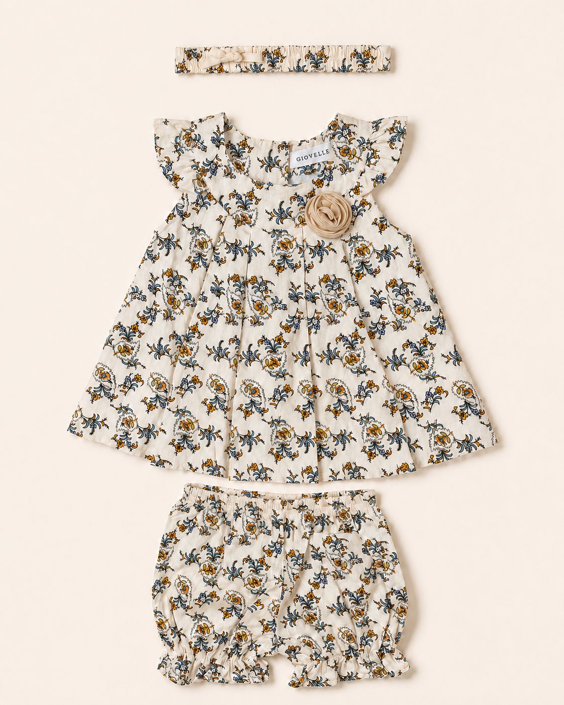 The Sunlit Meadow Set, a floral baby girl dress with bloomers and a headband