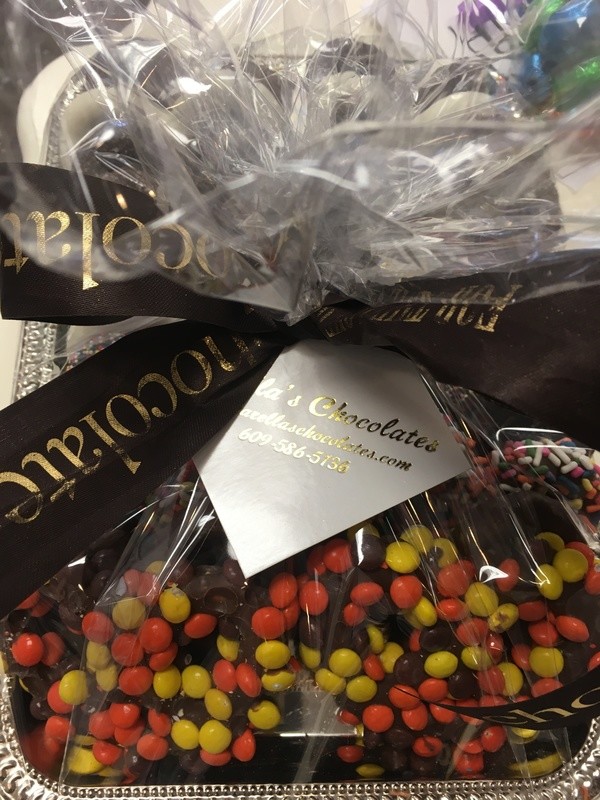 One and a Half Lbs. All Gourmet Large Three Ring Pretzels, Resse's, Oreo, Toffee, Sprinkles, Nonpariel and more. On tray with wrap and bow.