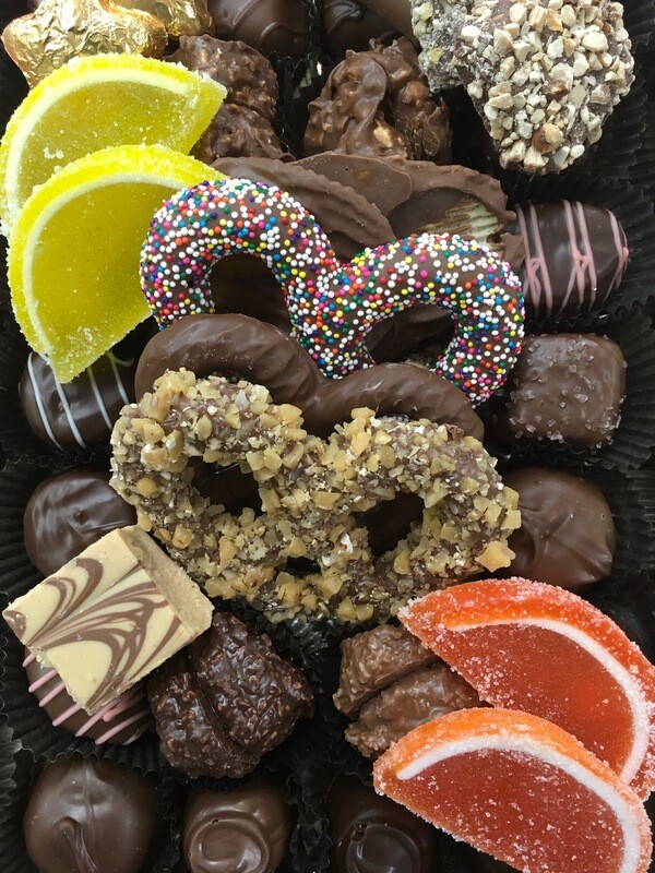 Anytime Tray! Let us add some color to your tray.  Brighten up someone's day.  Assorted Milk and Dark Chocolates, 3 Ring Pretzels, Fruit Slices, gold foiled stars.