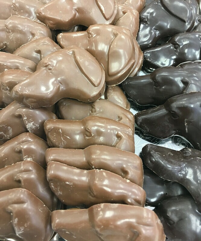 Solid Chocolate Dog Heads. . 2" x 1 1/2"approx. Peanut and Gluten Free.  24 to a Lb.