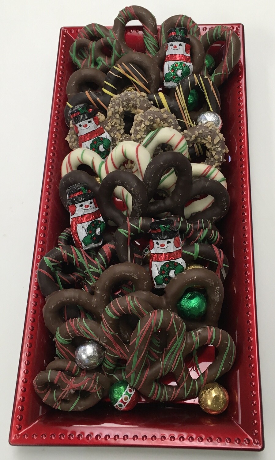 Red Christmas Pretzel Tray with Solid Chocolate Balls. Assorted Chocolates may be substituted.